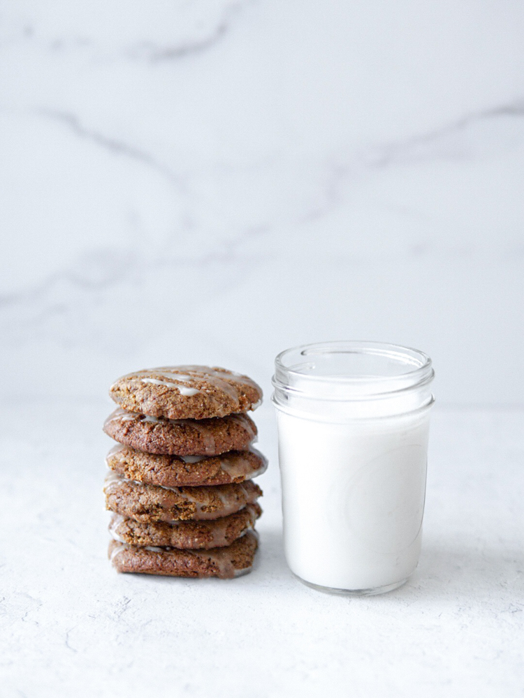 Soft, light and chewy lemon cardamom gingerbread cookies with a glass of almond milk.