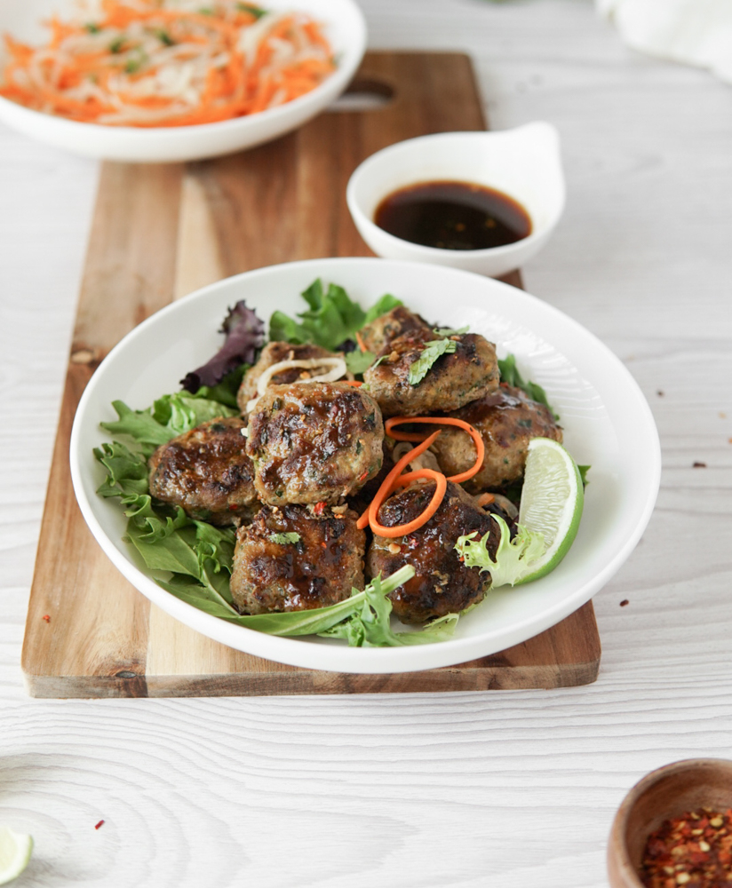 Low FODMAP grilled Vietnamese-style meatballs, served with a dipping sauce and a side of pickled carrot and daikon.