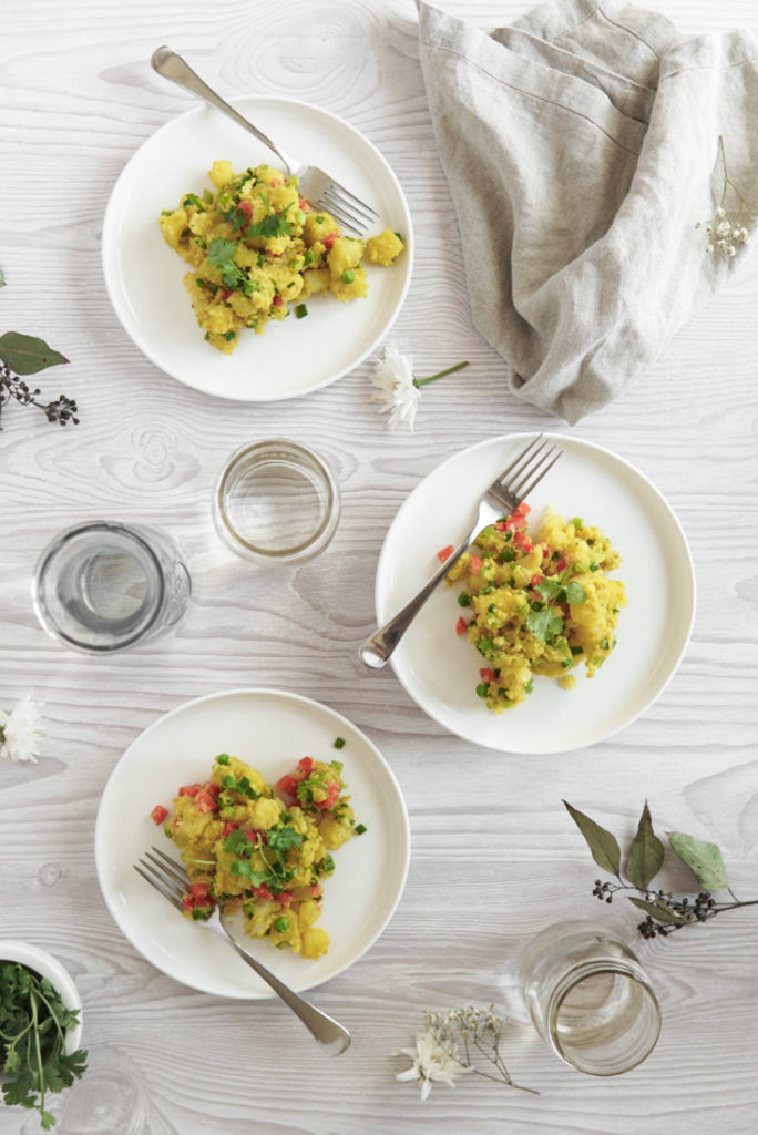 Low FODMAP Curried Potato Salad on 3 plates.