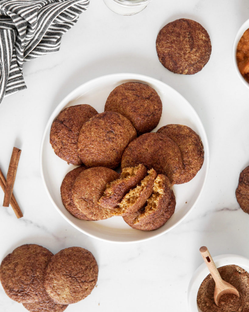 A pile of Low FODMAP, Paleo & Dairy Free Pumpkin Snickerdoodle Cookies. Super soft and delicious!