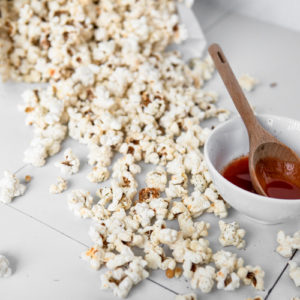 Low FODMAP Buffalo Ranch Popcorn, spilled all over the table. Oops!